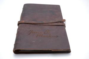 Engraving of the leather cover of a guest book