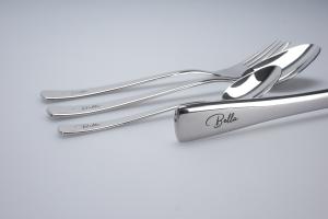 Engraving of a stainless steel cutlery with cursive script